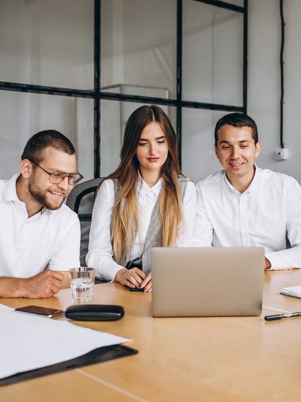 Group of people working out business plan in an office